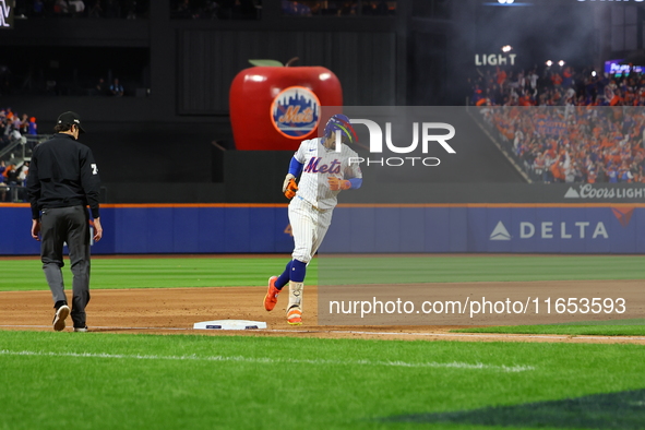 New York Mets player Francisco Lindor #12 rounds the bases after hitting a home run during the sixth inning in Game 4 of the baseball NL Div...