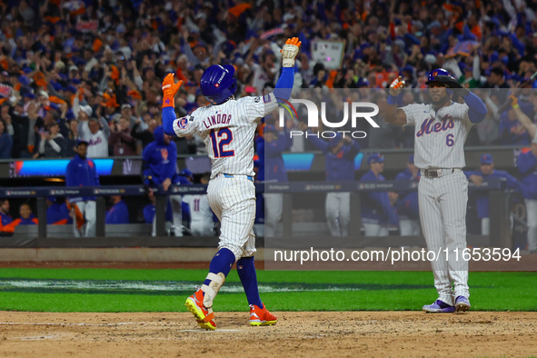 New York Mets player Francisco Lindor #12 rounds the bases after hitting a home run during the sixth inning in Game 4 of the baseball NL Div...