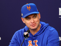 New York Mets manager Carlos Mendoza #64 speaks to the media during a press conference prior to Game 4 of a baseball NL Division Series agai...