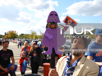 Fans participate in the Mets Block Party before the start of Game 4 of a baseball NL Division Series against the New York Mets at Citi Field...