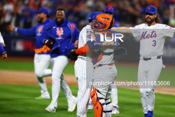 The New York Mets celebrate their 4-1 victory in Game 4 of a baseball NL Division Series against the Philadelphia Phillies at Citi Field in...