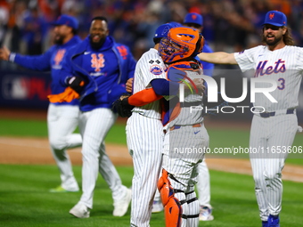 The New York Mets celebrate their 4-1 victory in Game 4 of a baseball NL Division Series against the Philadelphia Phillies at Citi Field in...