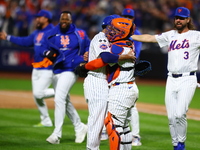 The New York Mets celebrate their 4-1 victory in Game 4 of a baseball NL Division Series against the Philadelphia Phillies at Citi Field in...