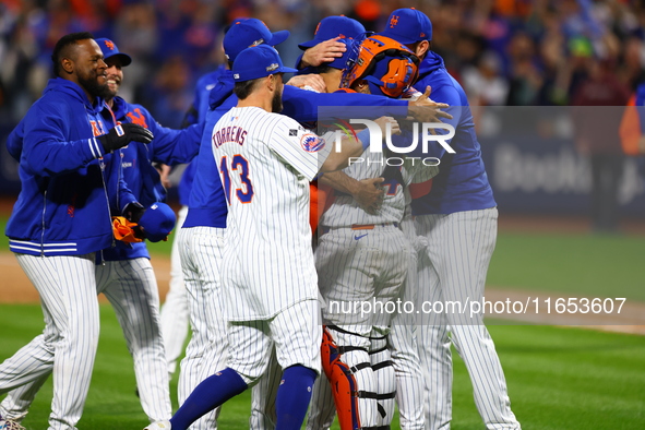 The New York Mets celebrate their 4-1 victory in Game 4 of a baseball NL Division Series against the Philadelphia Phillies at Citi Field in...