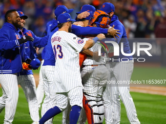 The New York Mets celebrate their 4-1 victory in Game 4 of a baseball NL Division Series against the Philadelphia Phillies at Citi Field in...