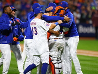 The New York Mets celebrate their 4-1 victory in Game 4 of a baseball NL Division Series against the Philadelphia Phillies at Citi Field in...