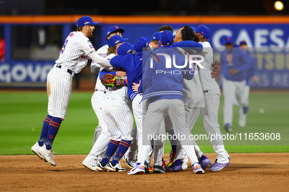 The New York Mets celebrate their 4-1 victory in Game 4 of a baseball NL Division Series against the Philadelphia Phillies at Citi Field in...