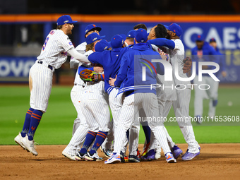 The New York Mets celebrate their 4-1 victory in Game 4 of a baseball NL Division Series against the Philadelphia Phillies at Citi Field in...