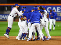 The New York Mets celebrate their 4-1 victory in Game 4 of a baseball NL Division Series against the Philadelphia Phillies at Citi Field in...