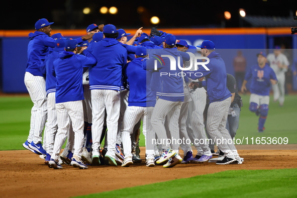 The New York Mets celebrate their 4-1 victory in Game 4 of a baseball NL Division Series against the Philadelphia Phillies at Citi Field in...