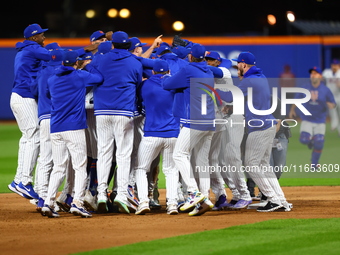 The New York Mets celebrate their 4-1 victory in Game 4 of a baseball NL Division Series against the Philadelphia Phillies at Citi Field in...