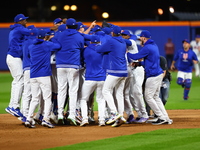 The New York Mets celebrate their 4-1 victory in Game 4 of a baseball NL Division Series against the Philadelphia Phillies at Citi Field in...