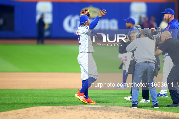 The New York Mets celebrate their 4-1 victory in Game 4 of a baseball NL Division Series against the Philadelphia Phillies at Citi Field in...