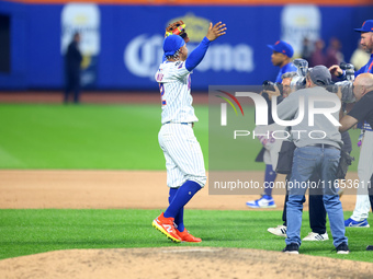 The New York Mets celebrate their 4-1 victory in Game 4 of a baseball NL Division Series against the Philadelphia Phillies at Citi Field in...