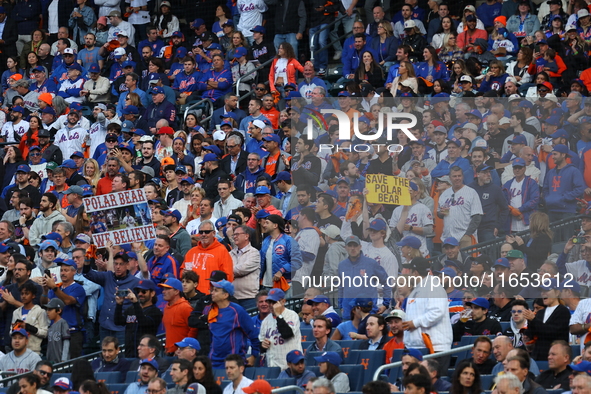 A New York Mets fan holds up a sign during the second inning in Game 4 of the baseball NL Division Series against the Philadelphia Phillies...