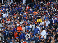 A New York Mets fan holds up a sign during the second inning in Game 4 of the baseball NL Division Series against the Philadelphia Phillies...