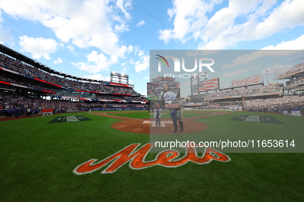 The national anthem is performed before game four of the NLDS between the Philadelphia Phillies and New York Mets at Citi Field in Flushing,...