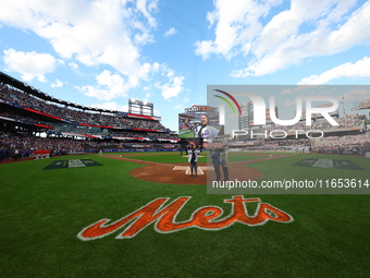 The national anthem is performed before game four of the NLDS between the Philadelphia Phillies and New York Mets at Citi Field in Flushing,...