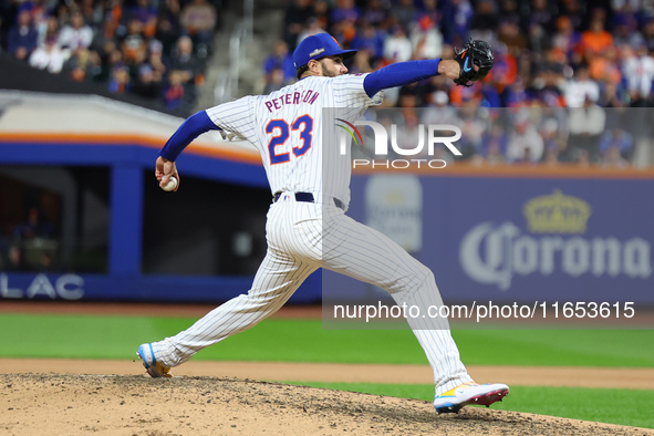 New York Mets starting pitcher David Peterson #23 throws during the eighth inning in Game 4 of the baseball NL Division Series against the P...