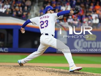 New York Mets starting pitcher David Peterson #23 throws during the eighth inning in Game 4 of the baseball NL Division Series against the P...