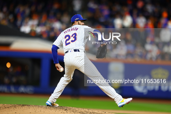 New York Mets starting pitcher David Peterson #23 throws during the seventh inning in Game 4 of a baseball NL Division Series against the Ph...