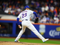 New York Mets starting pitcher David Peterson #23 throws during the seventh inning in Game 4 of a baseball NL Division Series against the Ph...