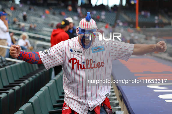 A Philadelphia Phillies fan appears pumped up for Game 4 of a baseball NL Division Series against the New York Mets at Citi Field in Flushin...