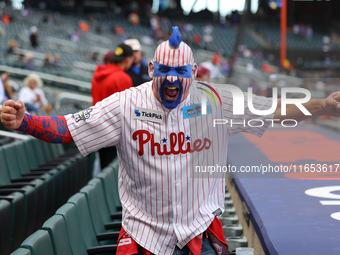 A Philadelphia Phillies fan appears pumped up for Game 4 of a baseball NL Division Series against the New York Mets at Citi Field in Flushin...