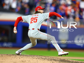 Philadelphia Phillies relief pitcher Matt Strahm #25 throws during the eighth inning in Game 4 of a baseball NL Division Series against the...