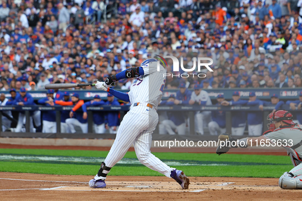 Mark Vientos #27 of the New York Mets doubles during the second inning in Game 4 of a baseball NL Division Series against the Philadelphia P...