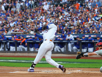 Mark Vientos #27 of the New York Mets doubles during the second inning in Game 4 of a baseball NL Division Series against the Philadelphia P...