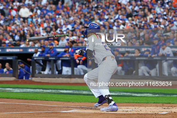 Mark Vientos #27 of the New York Mets doubles during the second inning in Game 4 of a baseball NL Division Series against the Philadelphia P...