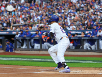 Mark Vientos #27 of the New York Mets doubles during the second inning in Game 4 of a baseball NL Division Series against the Philadelphia P...