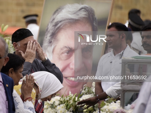 People gather to pay tribute to the mortal remains of Indian industrialist Ratan Tata at the National Centre for the Performing Arts (NCPA)...