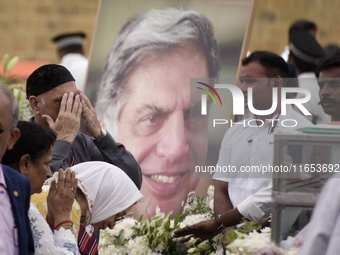 People gather to pay tribute to the mortal remains of Indian industrialist Ratan Tata at the National Centre for the Performing Arts (NCPA)...