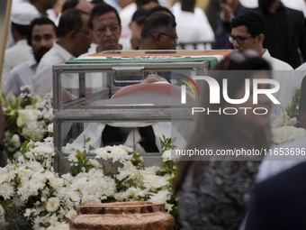 People gather to pay tribute to the mortal remains of Indian industrialist Ratan Tata at the National Centre for the Performing Arts (NCPA)...