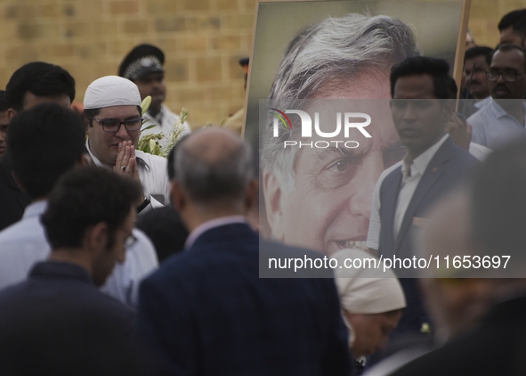 People gather to pay tribute to the mortal remains of Indian industrialist Ratan Tata at the National Centre for the Performing Arts (NCPA)...