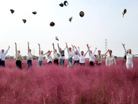 Retired soldiers and teachers visit a scenic spot to celebrate the upcoming Double Ninth Festival in Lianyungang, Jiangsu province, China, o...