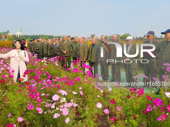 Retired soldiers and teachers visit a scenic spot to celebrate the upcoming Double Ninth Festival in Lianyungang, Jiangsu province, China, o...