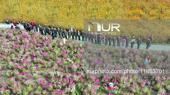 Retired soldiers and teachers visit a scenic spot to celebrate the upcoming Double Ninth Festival in Lianyungang, Jiangsu province, China, o...