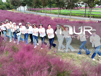 Retired soldiers and teachers visit a scenic spot to celebrate the upcoming Double Ninth Festival in Lianyungang, Jiangsu province, China, o...