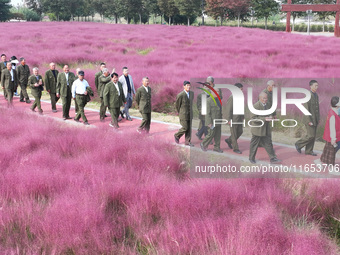 Retired soldiers and teachers visit a scenic spot to celebrate the upcoming Double Ninth Festival in Lianyungang, Jiangsu province, China, o...