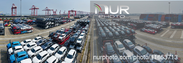 A batch of cars is about to be exported to overseas markets through frame transport at the International Container Terminal in Taicang Port...