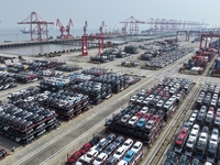 A batch of cars is about to be exported to overseas markets through frame transport at the International Container Terminal in Taicang Port...