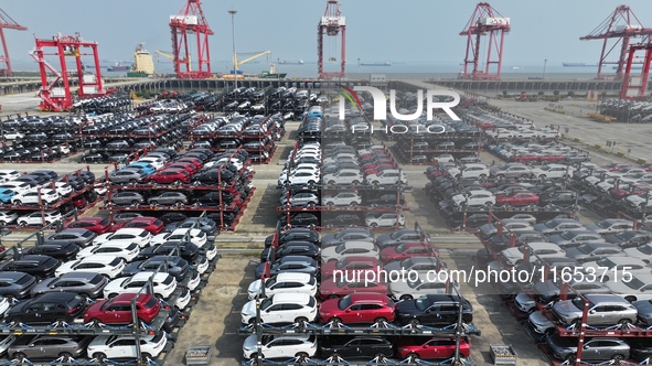 A batch of cars is about to be exported to overseas markets through frame transport at the International Container Terminal in Taicang Port...