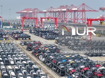 A batch of cars is about to be exported to overseas markets through frame transport at the International Container Terminal in Taicang Port...