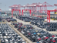 A batch of cars is about to be exported to overseas markets through frame transport at the International Container Terminal in Taicang Port...