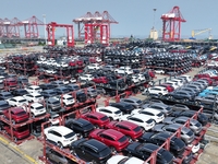 A batch of cars is about to be exported to overseas markets through frame transport at the International Container Terminal in Taicang Port...