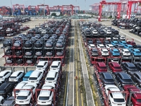 A batch of cars is about to be exported to overseas markets through frame transport at the International Container Terminal in Taicang Port...