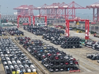 A batch of cars is about to be exported to overseas markets through frame transport at the International Container Terminal in Taicang Port...